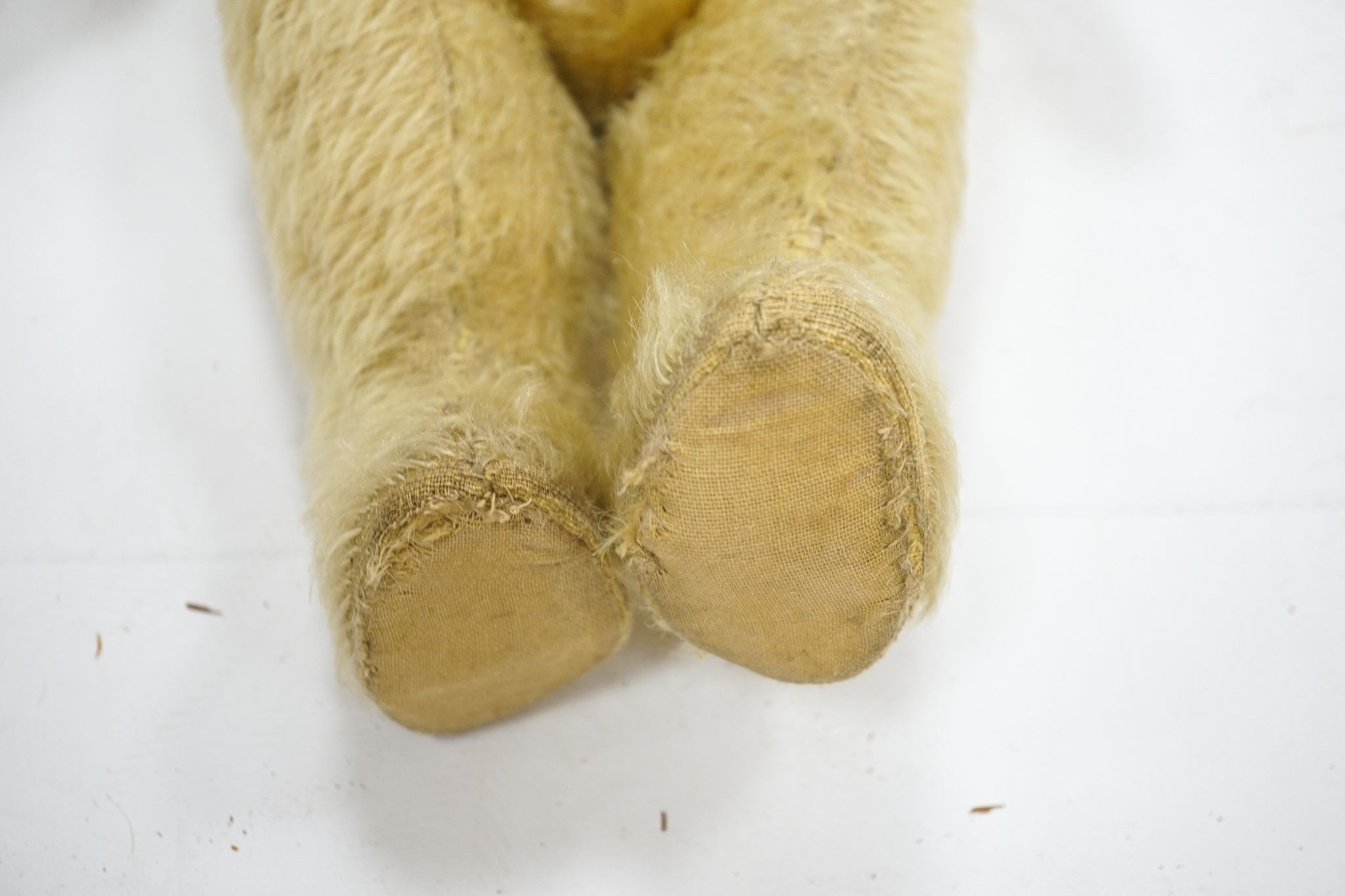 An early Chad Valley 1920's repaired pawpads, general thinning, 18in.